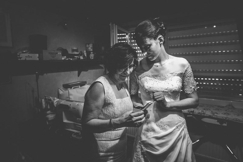 the photographer captures a moment of complicity between daughter and mother
