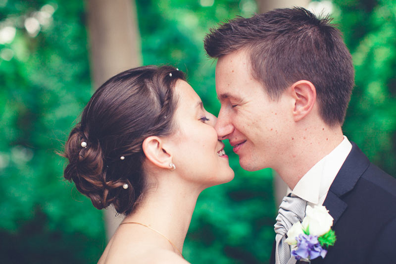 bride and groom kissing each other