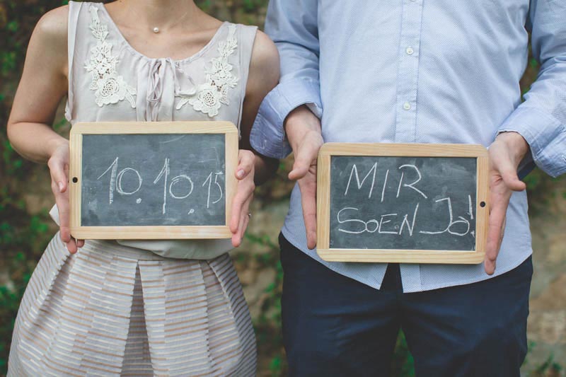 the photographer uses slates and chalk during the engagement session