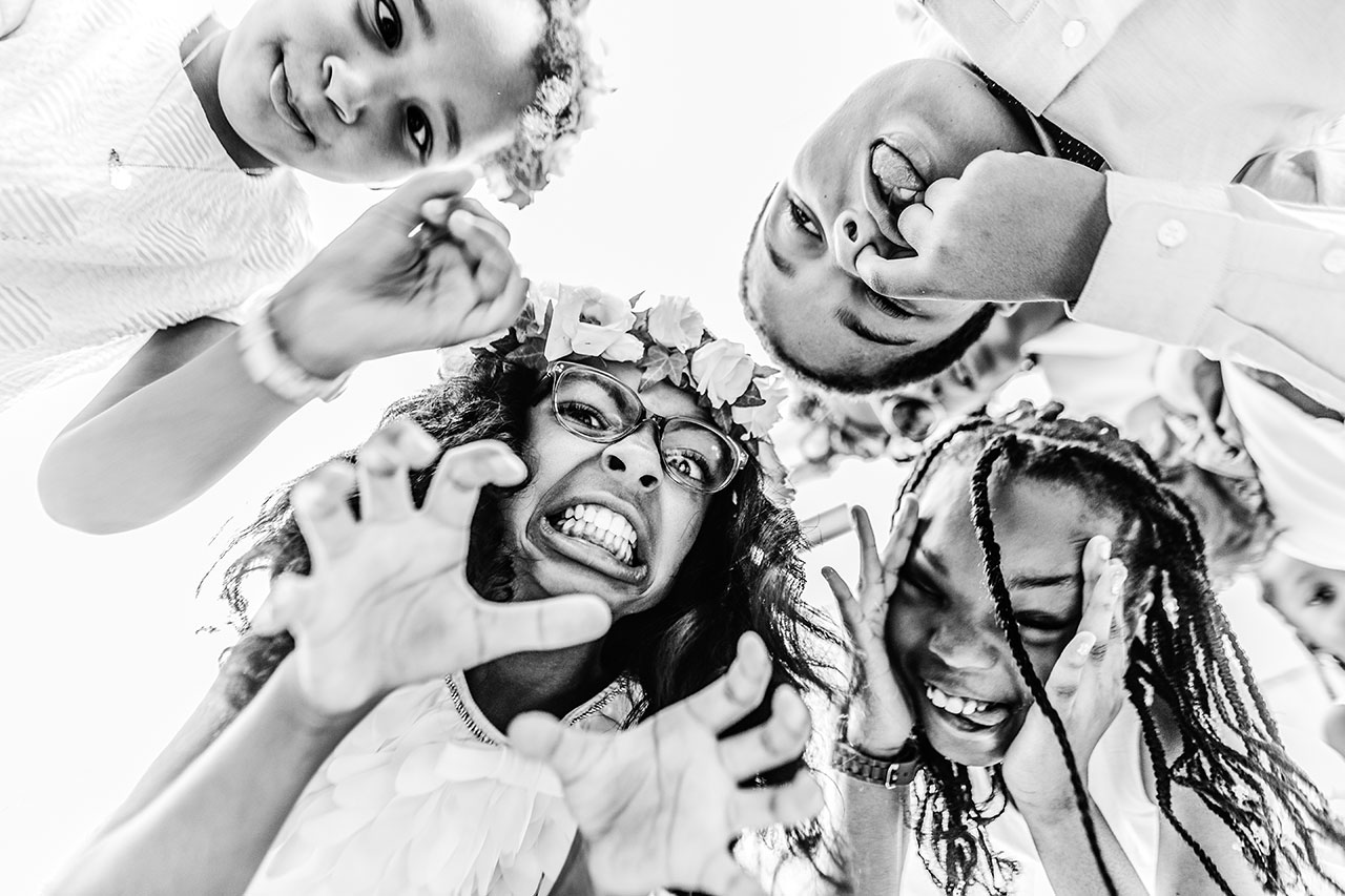 kids having fun with the wedding photographer