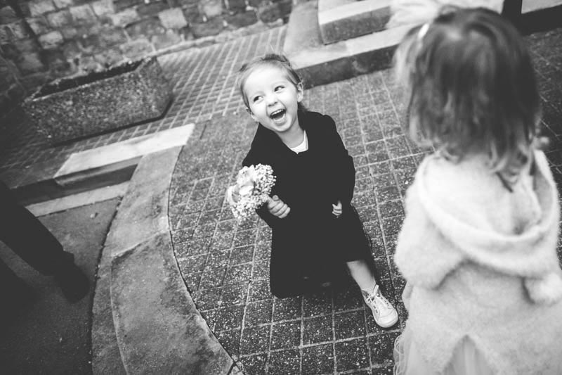 little girl laughing during the wedding