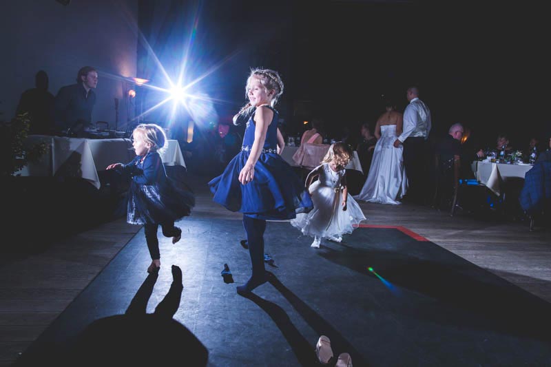 wedding party with strobes lighting up children