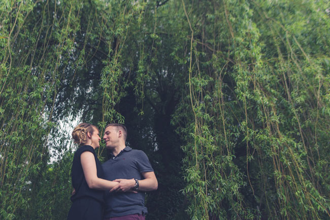 couple hugging under a tree