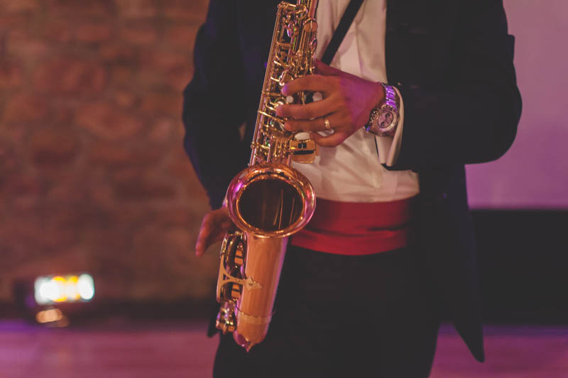 groom playing his saxophone