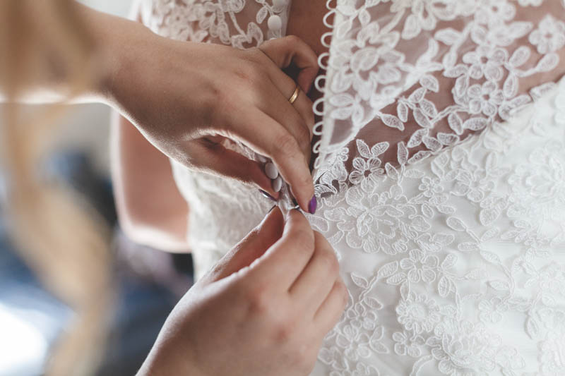 zooming on wedding dress zip