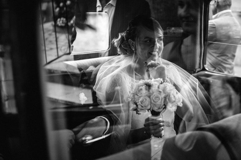 the bride in the car on the way to the ceremony
