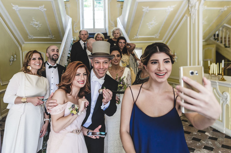 a selfie with the newlyweds