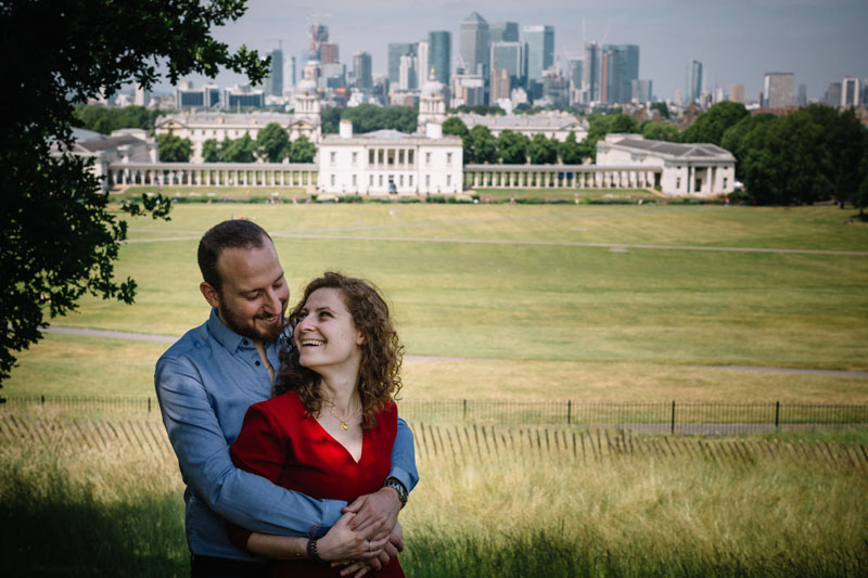 engaged couple posing in greenwich park