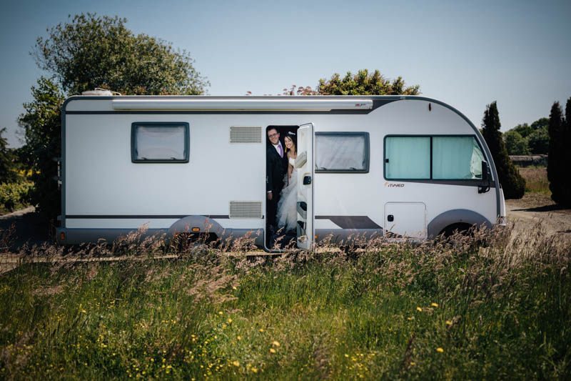 bride and groom in a camping car