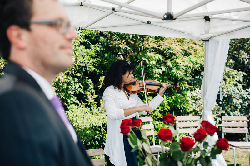 playing violin during wedding ceremony