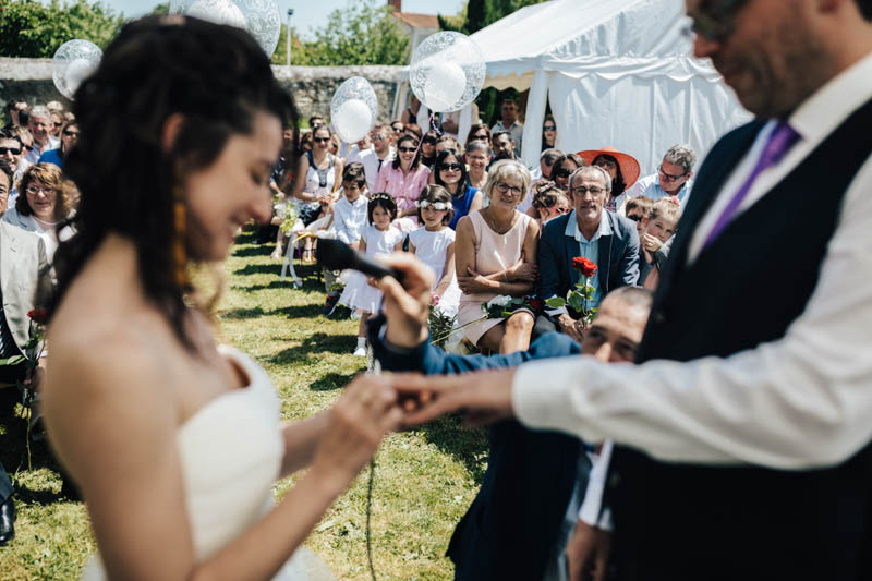 exchanging rings during symbolic ceremony