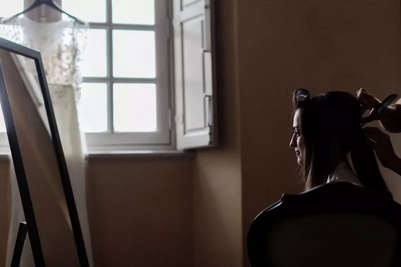 01 bride getting a hairdress