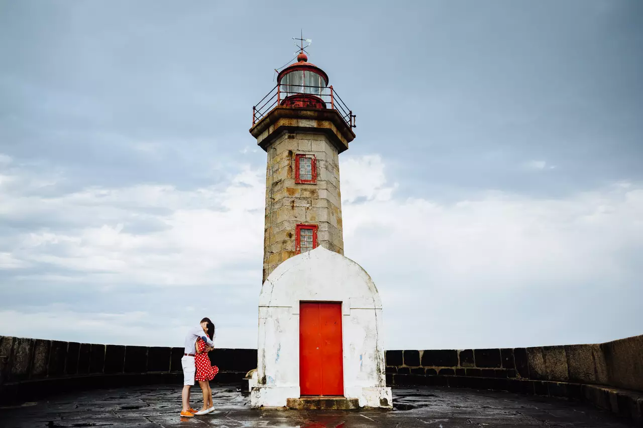 couple in love near a lighthouse